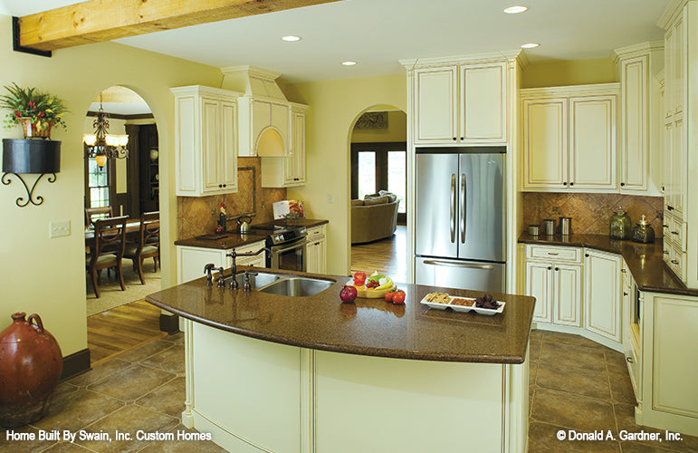 White cabinets and tile backsplash in the kitchen. The Wicklow plan 950.