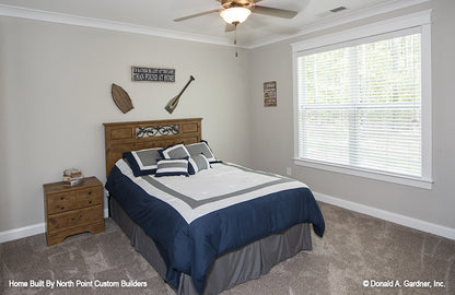 Crown molding and ceiling fan in another secondary bedroom. The Wilkerson plan 1296.