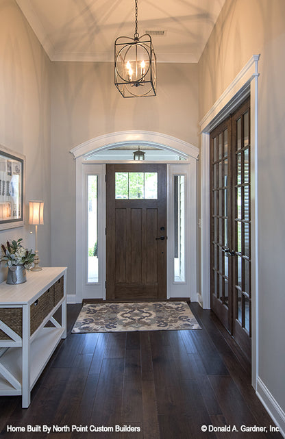 Arched molding over the entry door in the foyer. The Wilkerson plan 1296.