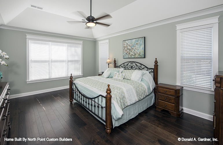 Tray ceiling and ceiling fan in the master bedroom. The Wilkerson plan 1296.