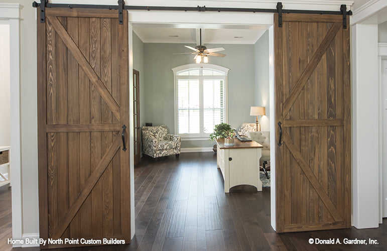 Farmhouse style doors to the study. The Wilkerson plan 1296.