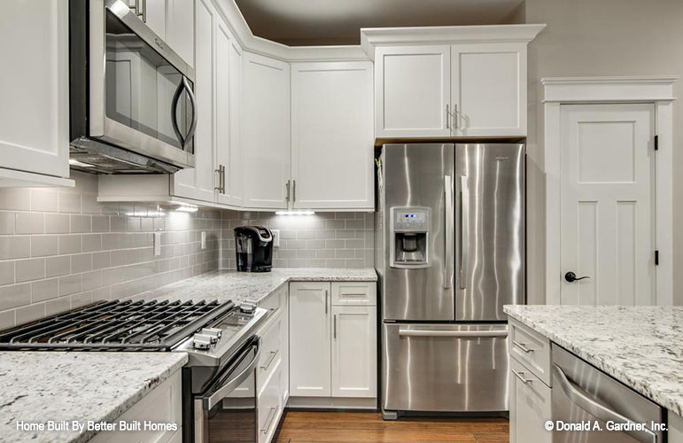 Stainless-steel appliances in the kitchen. The Williamette plan 1203.