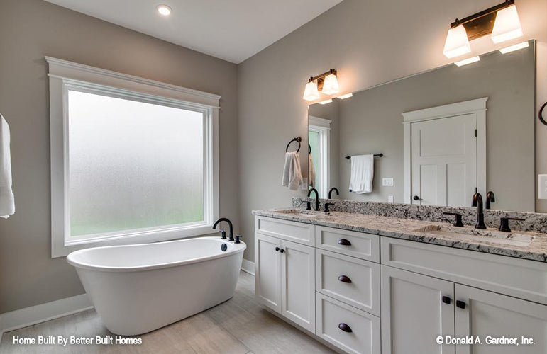 Stand-alone soaking tub in the master bathroom. The Williamette plan 1203.