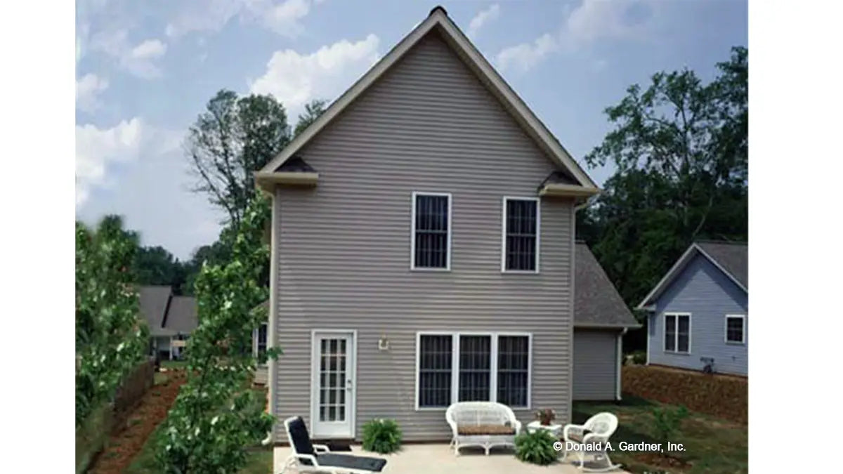 Rear view with patio seating, photograph submitted by the customer. The Willowbrook plan 453.