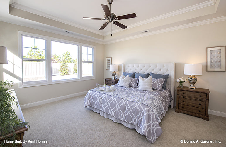 Tray ceiling and ceiling fan in the master bedroom. The Wilton plan 981.