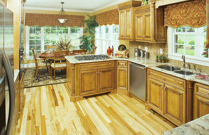 Oak cabinets and flooring in the kitchen. The Winslow plan 903.