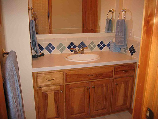 Single sink vanity in the bathroom. The Woodland plan 256.