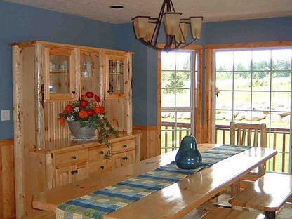 Wood trim along the windows in the dining room. The Woodland plan 256.