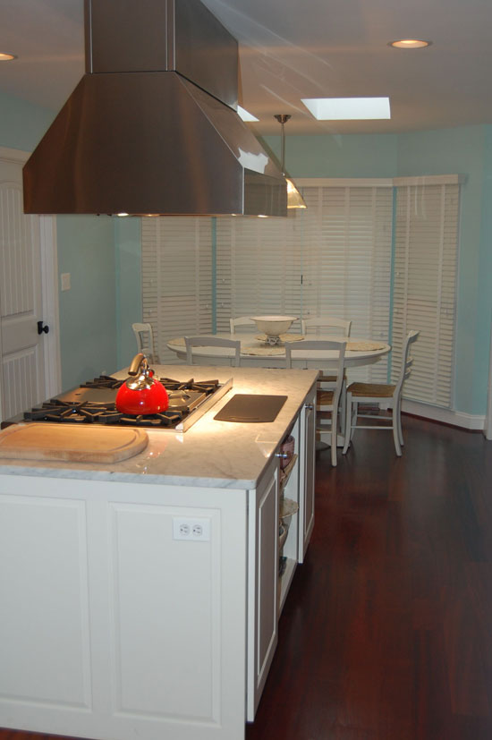 Stainless steel hood above the stove top in the kitchen. The Woodland plan 256.