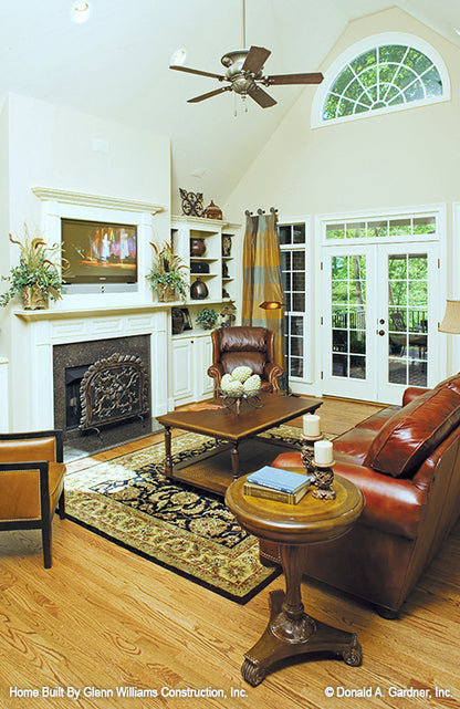 Fireplace and built in shelves in the great room. The Yankton plan 933.