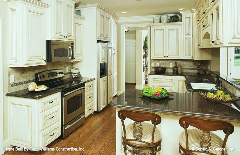 White cabinets in the kitchen. The Yankton plan 933.