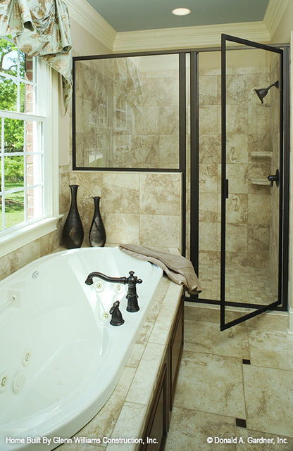 Soaking tub next to the walk-in shower in the master bathroom. The Yankton plan 933.