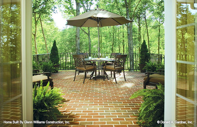 Dining table on the rear porch. The Yankton plan 933.