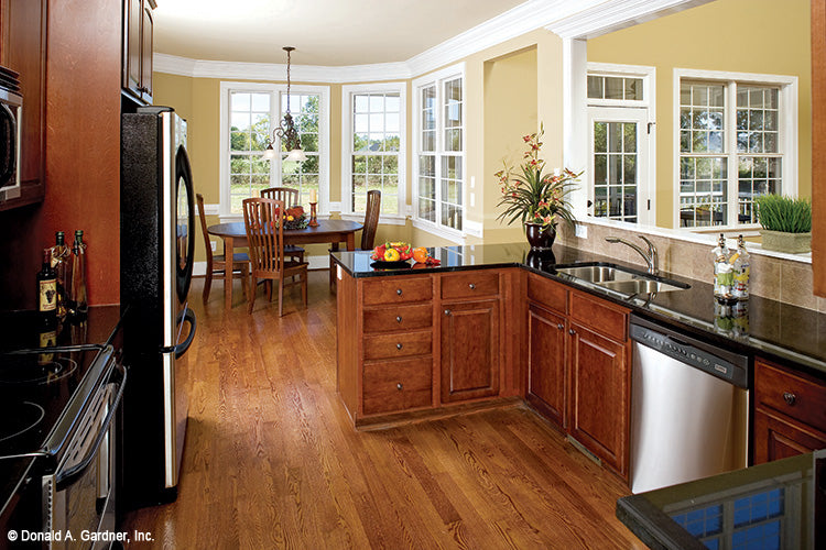 Flat ceiling in the kitchen and view to the breakfast nook. The Yarborough plan 964.