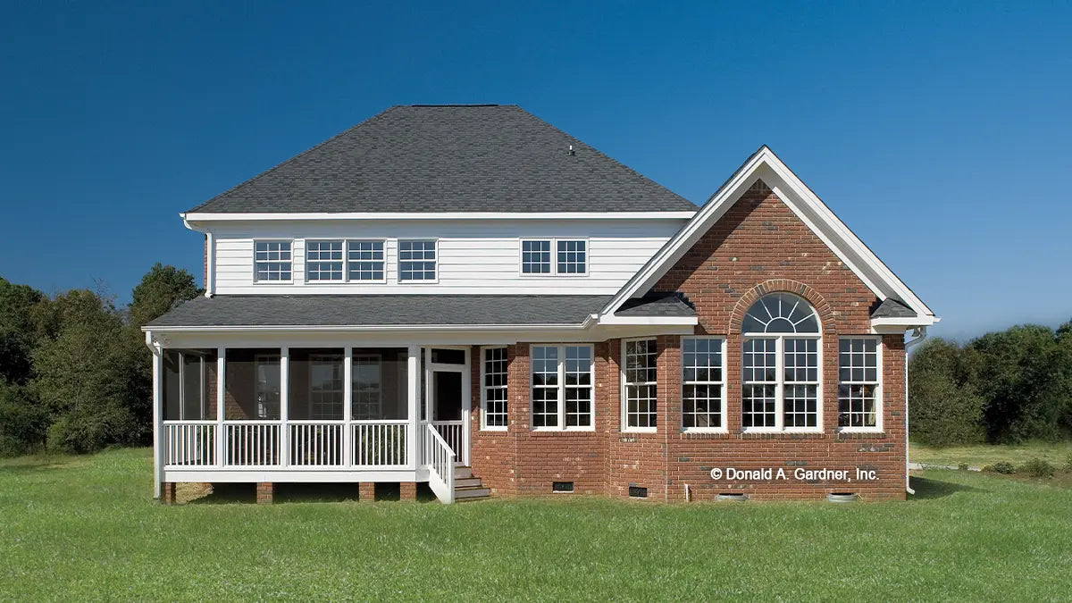 Rear view photograph with screened in porch. The Yarborough plan 964.