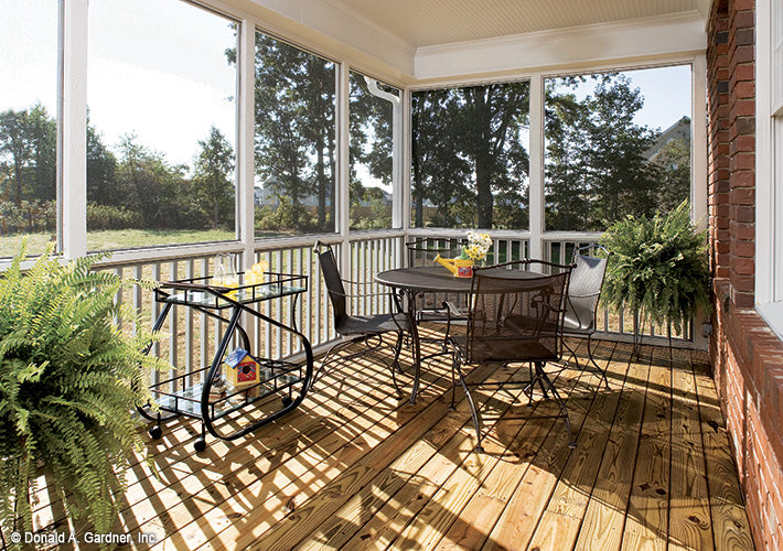 Seating in the screened in rear porch. The Yarborough plan 964.