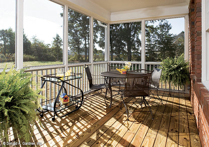 Seating in the screened in rear porch. The Yarborough plan 964.