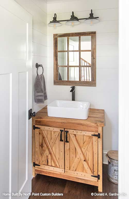 Farm style vanity in the bathroom. The Zander plan 1478.