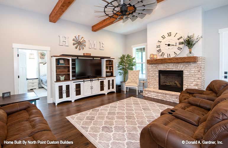 Stone fireplace in the great room. The Zander plan 1478.