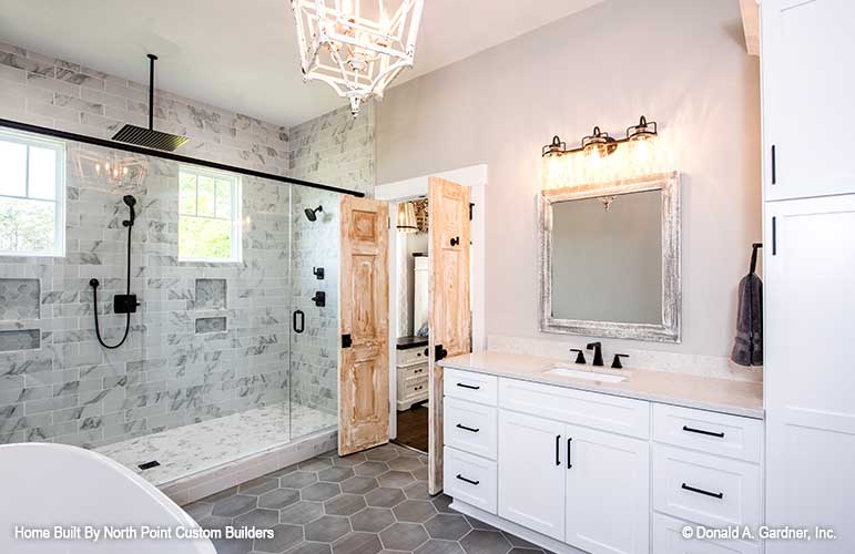 Single sink vanity in the master bathroom. The Zander plan 1478.