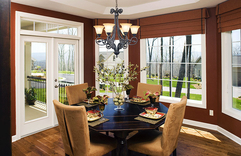 Wood floors and tray ceiling in the dining room. The Zeller plan 1014.