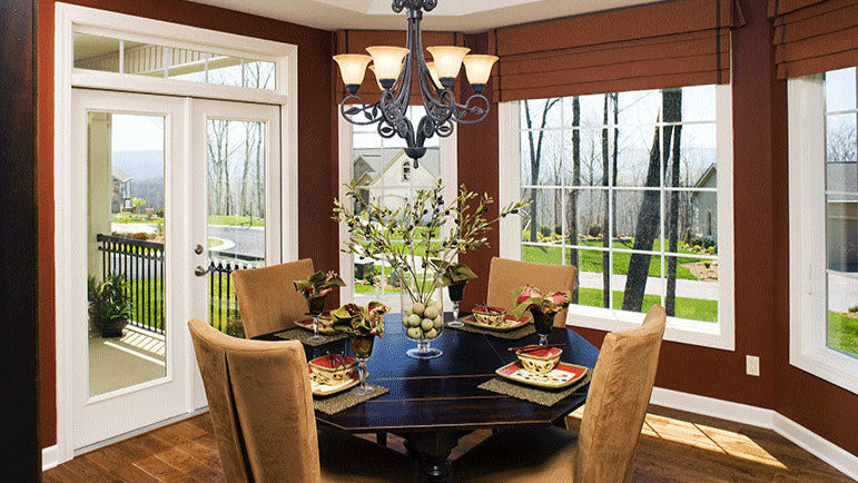 Wood floors and tray ceiling in the dining room. The Zeller plan 1014.