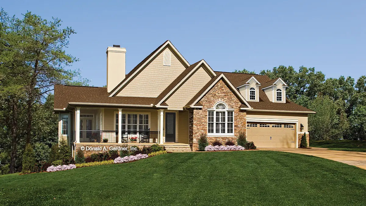 Front view photograph with large covered porch. photographs submitted by the customer. The Zeller plan 1014.