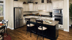 Wood floors and white cabinets in the kitchen. The Zeller plan 1014.